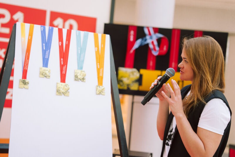 Press conference unveiling the 2026 medal design at the Spice shopping centre