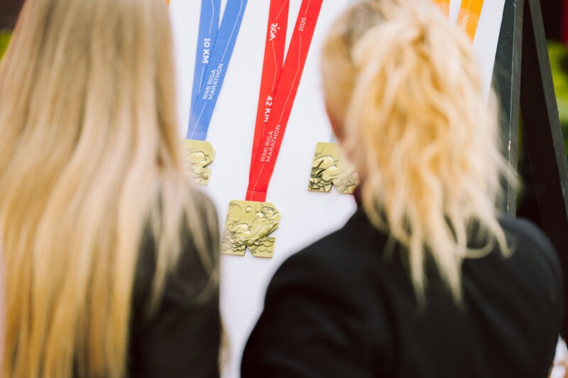 Press conference unveiling the 2026 medal design at the Spice shopping centre